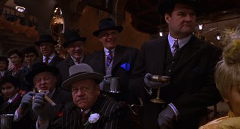 Movie still from “Mystery Men” (1999), directed by Kinka Usher – A group of men wearing suits and hats; Medium shot, Low angle