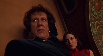 Movie still from “Mystery Men” (1999), directed by Kinka Usher – A man and a woman looking at the camera; Close Up shot, Low angle