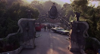 Movie still from “Mystery Men” (1999), directed by Kinka Usher – A group of people walking down a street; Extreme Wide shot, High angle