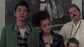 Movie still from “Mystery Train” (1989), directed by Jim Jarmusch – A group of young people standing next to each other; Close Up shot, Low angle