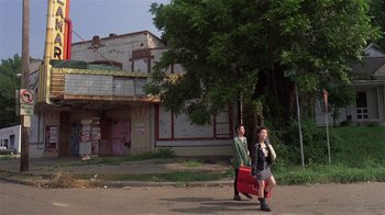 Movie still from “Mystery Train” (1989), directed by Jim Jarmusch – A man and a woman walking down a street; Extreme Wide shot, Low angle