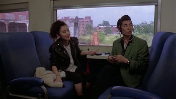 Movie still from “Mystery Train” (1989), directed by Jim Jarmusch – A man and a woman sitting in a room; Medium shot, Over the shoulder angle