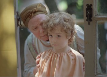 Movie still from “A Few Days from the Life of I.I. Oblomov” (1980), directed by Nikita Mikhalkov – An older woman and a young girl are looking at each other in a doorway; Close Up shot, Over the shoulder angle