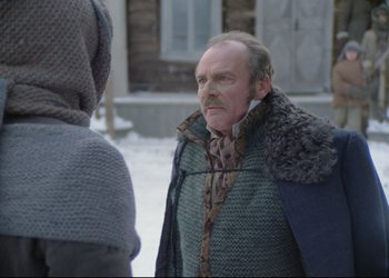 Movie still from “A Few Days from the Life of I.I. Oblomov” (1980), directed by Nikita Mikhalkov – An older man wearing a fur coat and a sweater; Medium shot, Over the shoulder angle