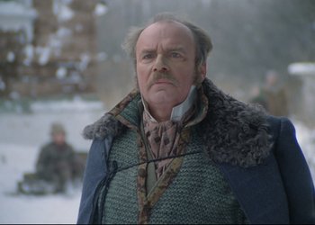 Movie still from “A Few Days from the Life of I.I. Oblomov” (1980), directed by Nikita Mikhalkov – An older man wearing a fur coat and a neck tie; Close Up shot, Low angle