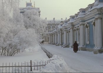 Movie still from “A Few Days from the Life of I.I. Oblomov” (1980), directed by Nikita Mikhalkov – A person walking down a snow covered street; Extreme Wide shot, Low angle