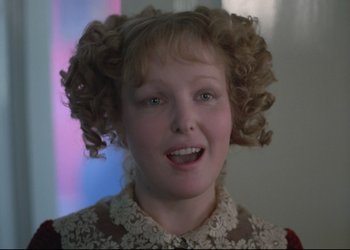 Movie still from “A Few Days from the Life of I.I. Oblomov” (1980), directed by Nikita Mikhalkov – A young girl with blonde hair and a lace dress; Close Up shot, Over the shoulder angle