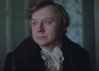 Movie still from “A Few Days from the Life of I.I. Oblomov” (1980), directed by Nikita Mikhalkov – A person wearing a suit and tie; Close Up shot, Low angle