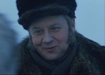 Movie still from “A Few Days from the Life of I.I. Oblomov” (1980), directed by Nikita Mikhalkov – A person wearing a hat and a fur coat; Close Up shot, Over the shoulder angle