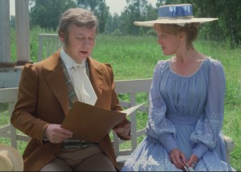 Movie still from “A Few Days from the Life of I.I. Oblomov” (1980), directed by Nikita Mikhalkov – A man and a woman sitting on a bench; Medium shot, Over the shoulder angle