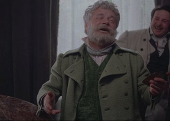 Movie still from “A Few Days from the Life of I.I. Oblomov” (1980), directed by Nikita Mikhalkov – An old man with a beard is talking to someone; Medium shot, Low angle