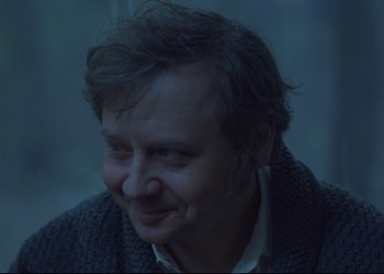 Movie still from “A Few Days from the Life of I.I. Oblomov” (1980), directed by Nikita Mikhalkov – A person wearing a sweater; Close Up shot, Low angle