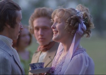 Movie still from “A Few Days from the Life of I.I. Oblomov” (1980), directed by Nikita Mikhalkov – A man and a woman standing next to each other holding a cup; Medium shot, Over the shoulder angle