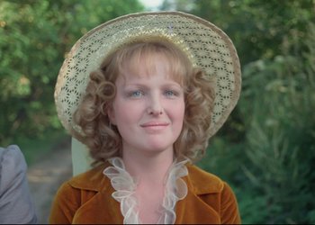 Movie still from “A Few Days from the Life of I.I. Oblomov” (1980), directed by Nikita Mikhalkov – A woman wearing a white hat and a brown jacket; Close Up shot, High angle