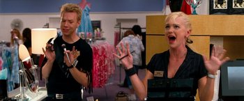 Movie still from “Observe and Report” (2009), directed by Jody Hill – A woman and a man in a dress shop; Medium shot, Over the shoulder angle