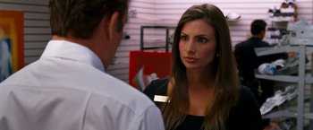 Movie still from “Observe and Report” (2009), directed by Jody Hill – A man and a woman are standing next to each other; Close Up shot, Over the shoulder angle