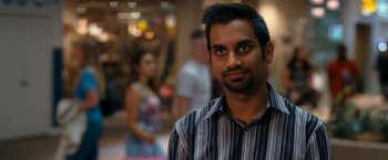 Movie still from “Observe and Report” (2009), directed by Jody Hill – A person wearing a striped shirt; Close Up shot, Over the shoulder angle