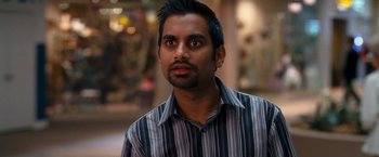 Movie still from “Observe and Report” (2009), directed by Jody Hill – A person wearing a striped shirt; Close Up shot, Over the shoulder angle