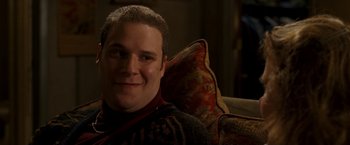 Movie still from “Observe and Report” (2009), directed by Jody Hill – A person sitting on a couch; Close Up shot, High angle