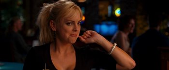 Movie still from “Observe and Report” (2009), directed by Jody Hill – A beautiful blond woman sitting at a table; Close Up shot, Over the shoulder angle