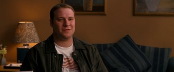Movie still from “Observe and Report” (2009), directed by Jody Hill – A man sitting on a couch in a living room; Close Up shot, High angle