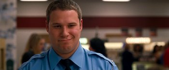 Movie still from “Observe and Report” (2009), directed by Jody Hill – A person wearing a uniform; Close Up shot, Low angle