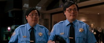 Movie still from “Observe and Report” (2009), directed by Jody Hill – A couple of men standing next to each other; Close Up shot, High angle