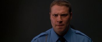 Movie still from “Observe and Report” (2009), directed by Jody Hill – A man in a police uniform is looking at the camera; Close Up shot, Low angle