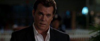 Movie still from “Observe and Report” (2009), directed by Jody Hill – A person wearing a suit and tie; Close Up shot, Over the shoulder angle