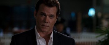 Movie still from “Observe and Report” (2009), directed by Jody Hill – A person wearing a suit and tie; Close Up shot, Over the shoulder angle