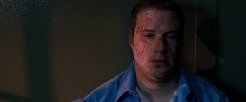 Movie still from “Observe and Report” (2009), directed by Jody Hill – A person with blood on his face; Close Up shot, High angle