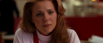 Movie still from “Observe and Report” (2009), directed by Jody Hill – A person with long red hair; Close Up shot, Over the shoulder angle