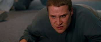 Movie still from “Observe and Report” (2009), directed by Jody Hill – A person with his eyes wide open; Close Up shot, Low angle