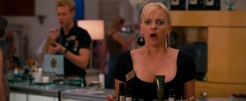 Movie still from “Observe and Report” (2009), directed by Jody Hill – A woman with a surprised look on her face; Close Up shot, Over the shoulder angle
