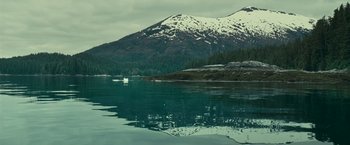 Movie still from “Oceans” (2009), directed by Jacques Cluzaud – A body of water with a mountain in the background; Extreme Wide shot, High angle