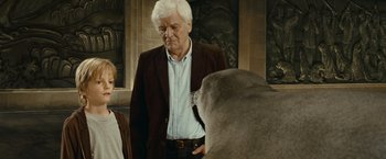 Movie still from “Oceans” (2009), directed by Jacques Cluzaud – An older man standing next to an older woman; Medium shot, Over the shoulder angle