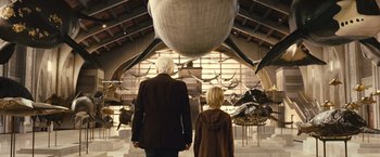 Movie still from “Oceans” (2009), directed by Jacques Cluzaud – A man and a child looking at a museum; Wide shot, Low angle