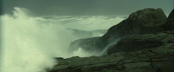 Movie still from “Oceans” (2009), directed by Jacques Cluzaud – A view of the ocean from a rocky cliff; Extreme Wide shot, Low angle