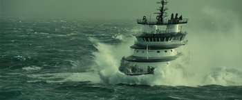 Movie still from “Oceans” (2009), directed by Jacques Cluzaud – A large boat in the middle of the ocean; Extreme Wide shot, High angle