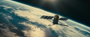 Movie still from “Oceans” (2009), directed by Jacques Cluzaud – An image of a satellite in the sky above the earth; Extreme Wide shot, Low angle