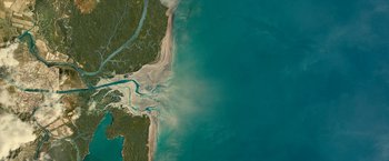 Movie still from “Oceans” (2009), directed by Jacques Cluzaud – An aerial view of a body of water; Extreme Wide shot, Overhead angle