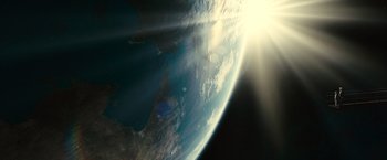 Movie still from “Oceans” (2009), directed by Jacques Cluzaud – A view of the earth from space with the sun shining; Extreme Wide shot, High angle