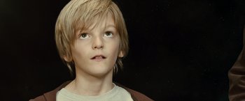 Movie still from “Oceans” (2009), directed by Jacques Cluzaud – A young boy looking up into the sky; Close Up shot, Low angle