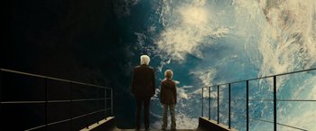 Movie still from “Oceans” (2009), directed by Jacques Cluzaud – A man and a boy looking at the sky; Wide shot, High angle
