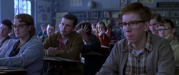 Movie still from “October Sky” (1999), directed by Joe Johnston – A group of people sitting in a classroom; Medium shot, Low angle