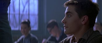 Movie still from “October Sky” (1999), directed by Joe Johnston – A young man looking off into the distance; Close Up shot, Over the shoulder angle