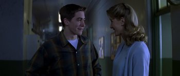 Movie still from “October Sky” (1999), directed by Joe Johnston – A man and a woman talking to each other; Medium shot, Over the shoulder angle