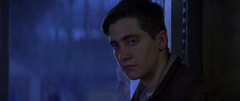 Movie still from “October Sky” (1999), directed by Joe Johnston – A young man is looking into the camera; Close Up shot, Over the shoulder angle