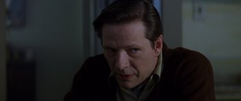 Movie still from “October Sky” (1999), directed by Joe Johnston – A person wearing a suit and tie; Close Up shot, Low angle