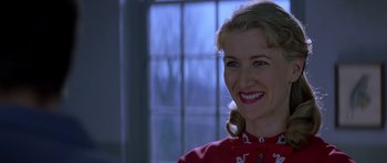 Movie still from “October Sky” (1999), directed by Joe Johnston – A person wearing a red shirt; Close Up shot, Over the shoulder angle